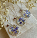 The November Birthstone flower silver necklace.