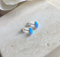 925 sterling silver Blue Opal teardrop stud earrings.