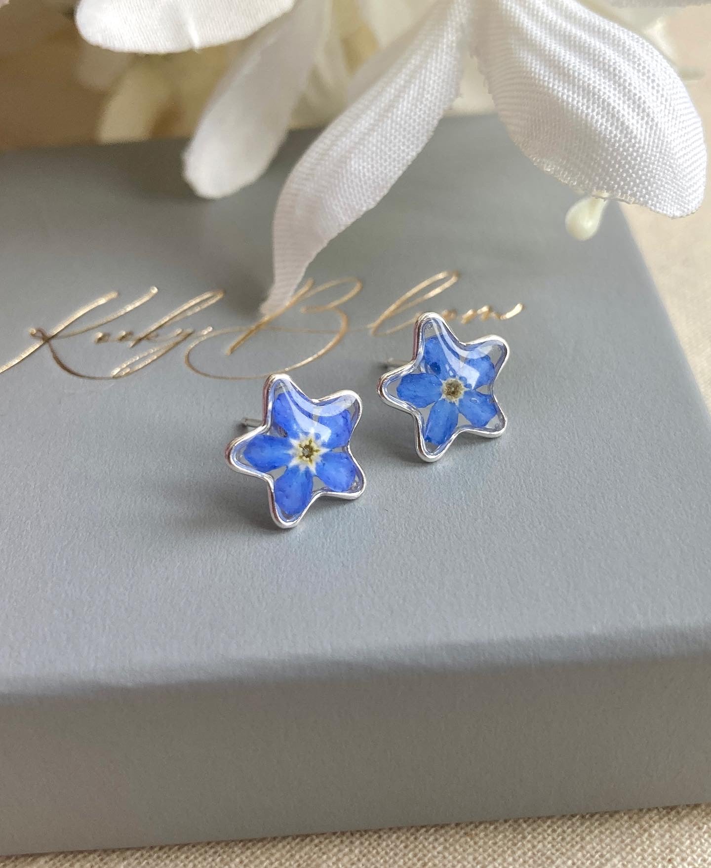 925 sterling silver real forget me not flower stud earrings.